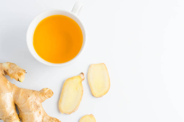 istock hot ginger tea ginger ale ginger beer in glass with ginger slice on white background 891794496