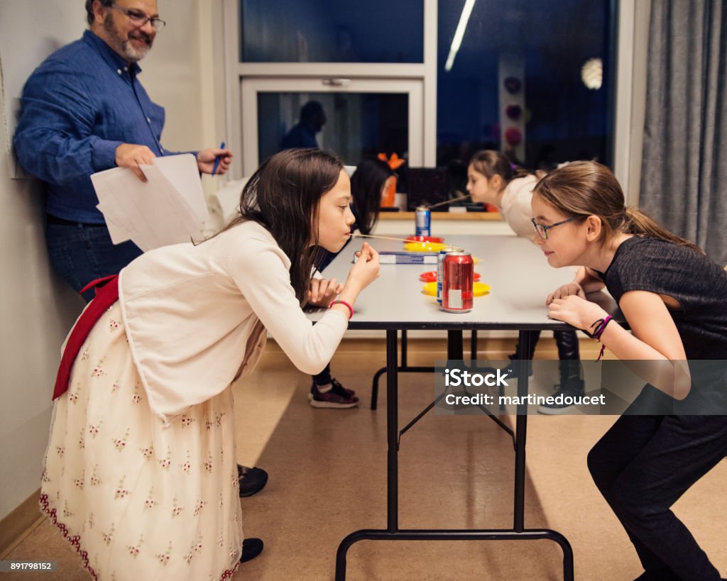 Children Playing A Funny Game At A Family Reunion Stock Photo - Download  Image Now - Can, Canada, Celebration - iStock