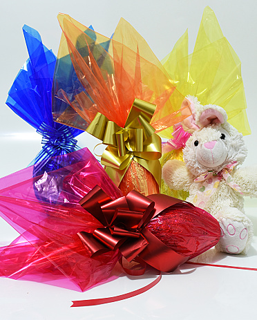 Straws, confetti and streamers prepared for birthday on white background, flat lay. Space for text
