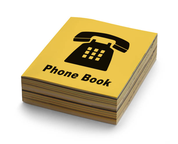 Phone Book Yellow Phone Book with Black Phone on Cover Isolated on White Background. telephone directory stock pictures, royalty-free photos & images
