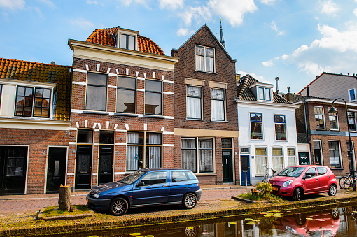 DELFT, NETHERLANDS - MAY 2, 2015: Beautiful architecture of Delft, Netherlands. Delft is a popular touristic destination due to the town centre with canals