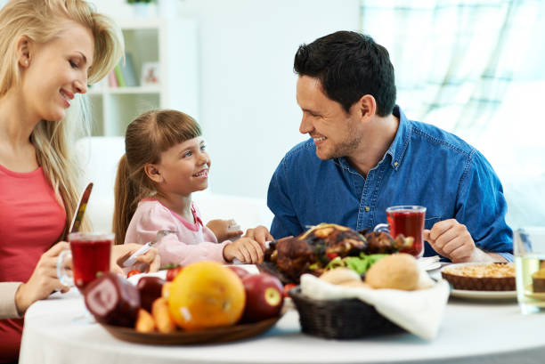 istock Cheerful family having dinner 891827050
