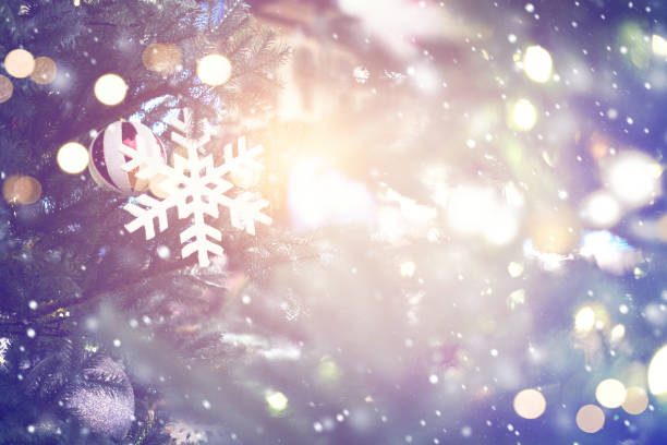 istock Christmas abstract background with snowflakes and lighting effect 891827096