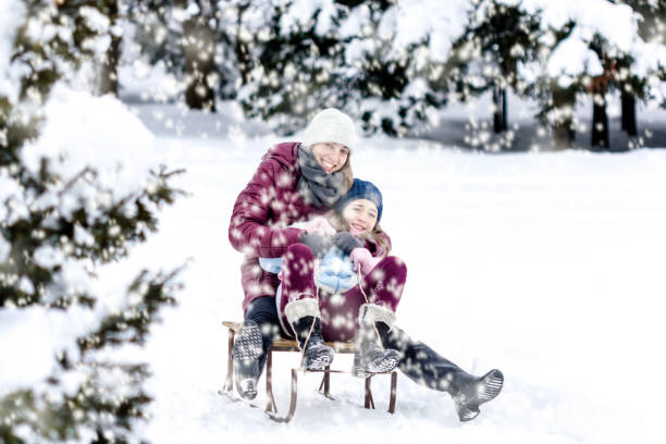 istock Girls having fun together in the snow. 891829374