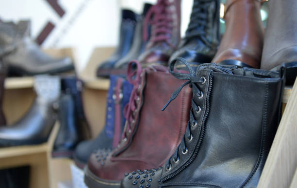 istock winter boots display for sale in clothing store 891830258
