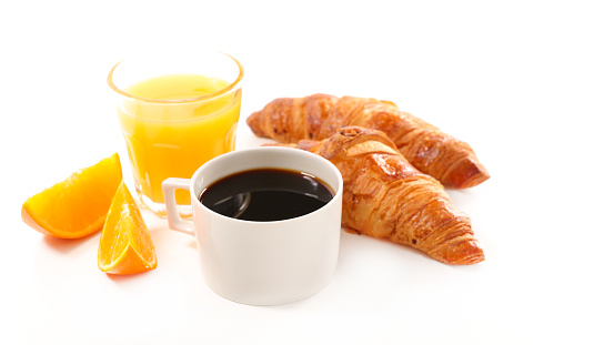 coffee cup, croissant and orange juice