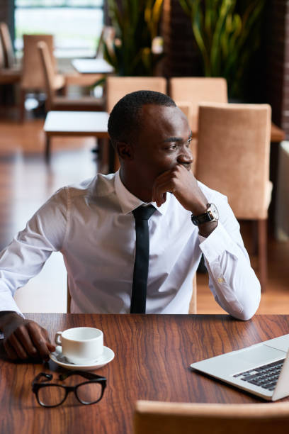 istock Pensive African-American businessman drinking coffee 891833226