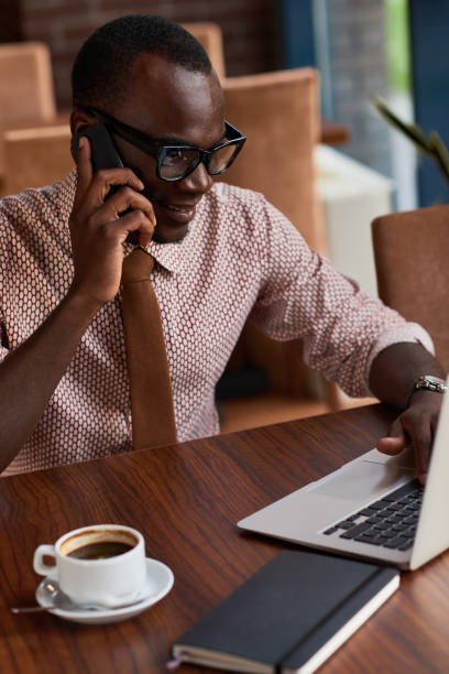 istock Multitasking African-American businessman 891835454