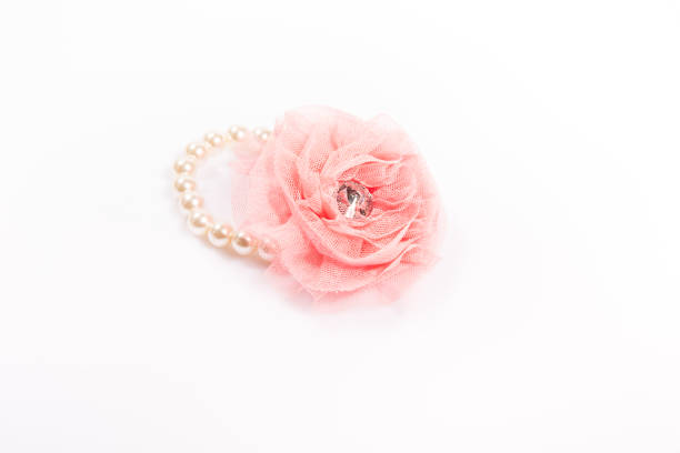 istock Pink flower pearls hair band. 891840608