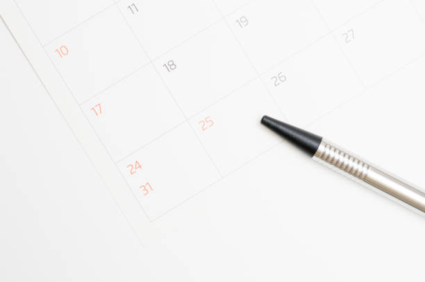 istock Calendar and pen on white background 891840612
