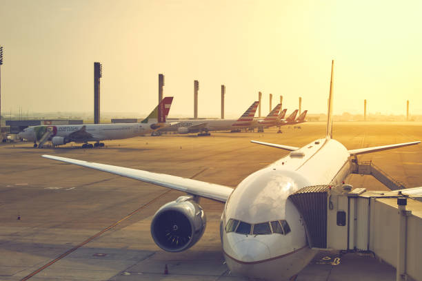 A traveler photographs many airplanes parked at Tom Jobim Airport, Rio de Janeiro, Brazil. stock photo