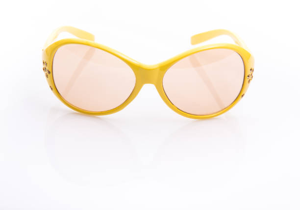 The Yellow sunglasses on the white background.