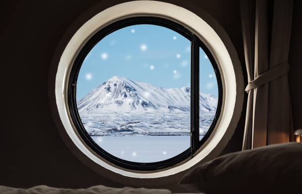 istock Looking through window in winter, snow landscape with mountain snow fall in winter morning 891850962