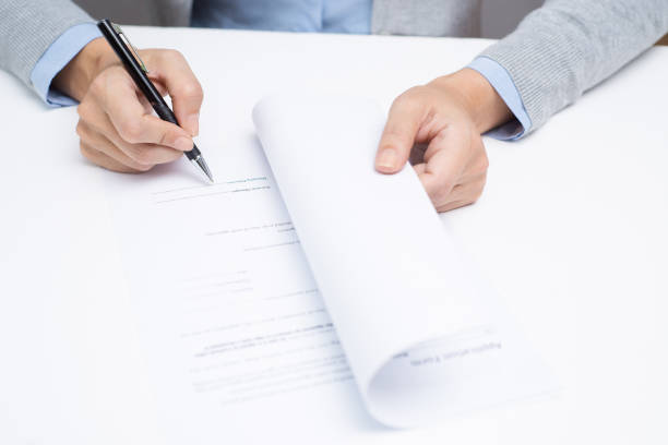 istock Female candidate signing contract with employer 891869618