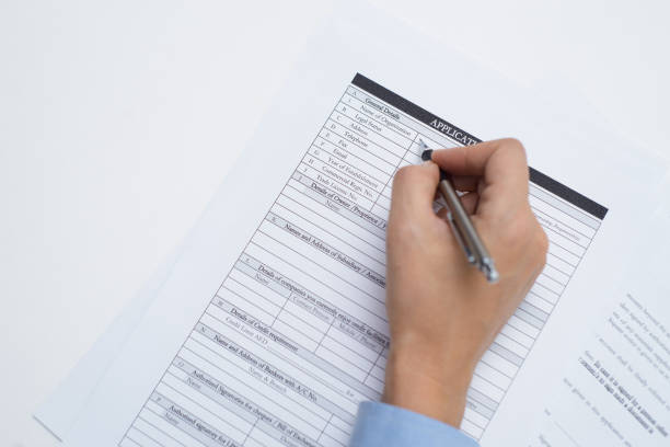 istock Female hand writing with pen 891869636