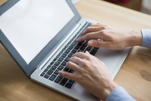 istock Closeup of Person Working on Laptop Computer 891872566