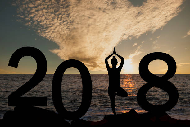istock New year 2018 yoga concept woman pose 891879888