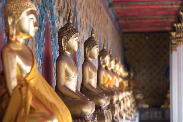 istock Row of Buddha statues at Wat Arun, Bangkok 891879964