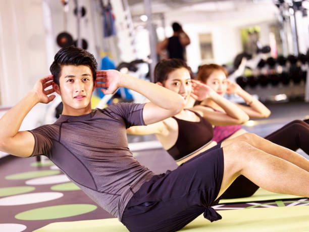 istock young asian adults in aerobics class 891882948