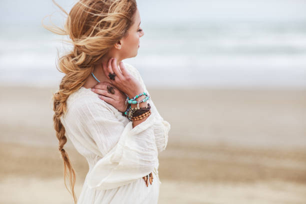 Dreamy girl on beach Dreamy girl on beach bohemian fashion stock pictures, royalty-free photos & images