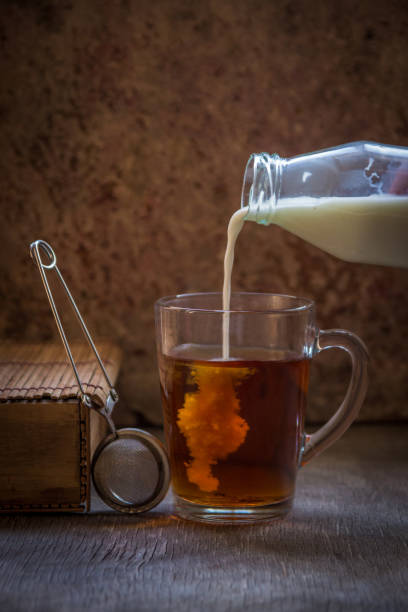 istock Tea with milk. Hot black tea in a glass mug 891926058