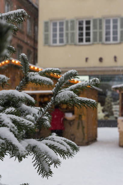 istock snowfall on christmas marketplace in advent december 2 891931714
