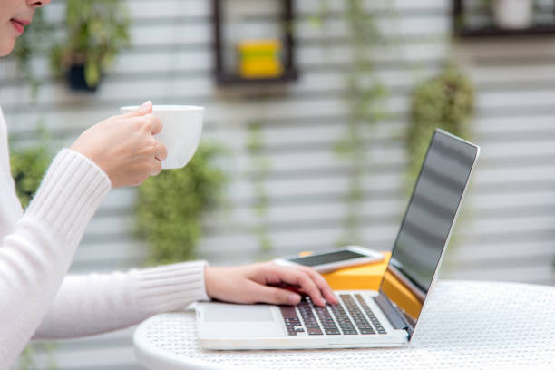 istock Close up hand women working on keyboard.  Work space relaxing chill out work for office and design laptop smartphone with morning coffee.  Business and Lifestyle Concept. 891933498