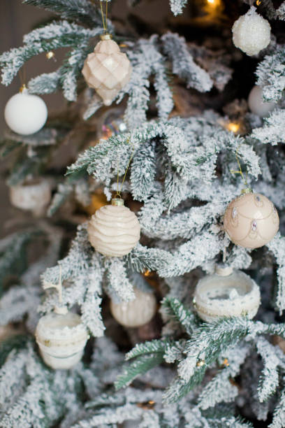 istock snowy Christmas tree with vintage decorations 891939638