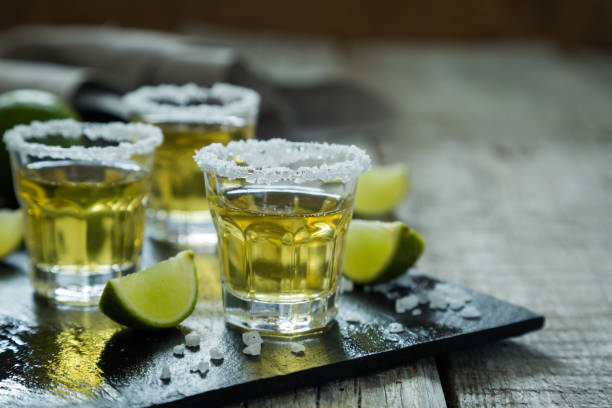 istock Gold tequila with lime and salt 891945354