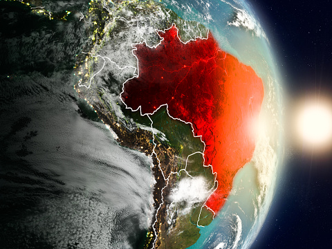 Brazil during sunrise highlighted in red on planet Earth with visible country borders. 3D illustration. Elements of this image furnished by NASA. 3D model of planet created and rendered in Cheetah3D software, 7 Dec 2017. URL of the source map: https://visibleearth.nasa.gov/view.php?id=57752