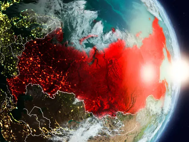 Russia during sunrise highlighted in red on planet Earth with visible country borders. 3D illustration. Elements of this image furnished by NASA. 3D model of planet created and rendered in Cheetah3D software, 7 Dec 2017. URL of the source map: https://visibleearth.nasa.gov/view.php?id=57752