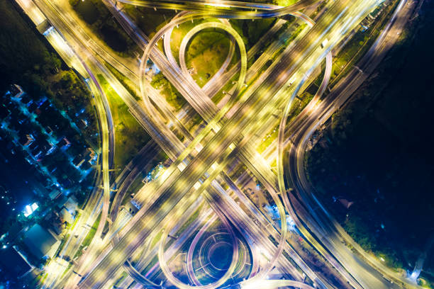 istock Night traffic aerial view vehicle light 891950094