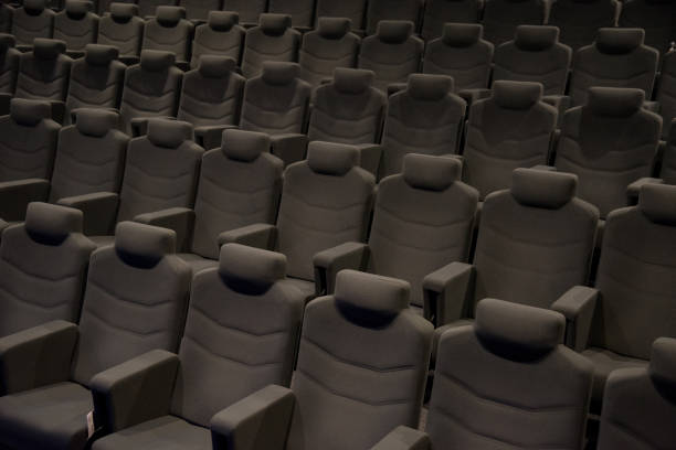 istock Cinema hall with beige armchairs 891953482