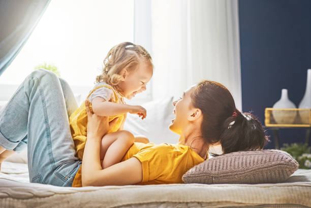 istock Mom and her daughter are playing 891955484