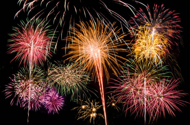 istock Colourful Fireworks at night over dark sky 891956400