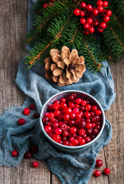 istock Red cranberries on a old wooden table 891968818