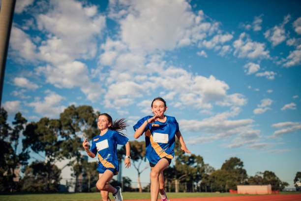 istock Girls Running Race 891972638