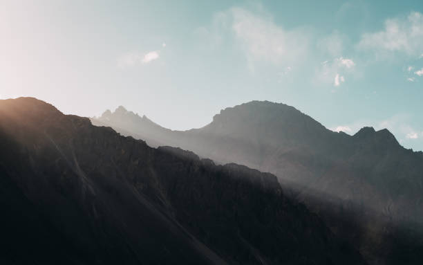 istock Mountains and blue sky while sunset in the background 891976624