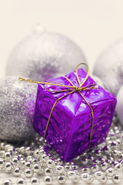 istock Silver Christmas decoration, balls, beads, bell close up isolated 891978404