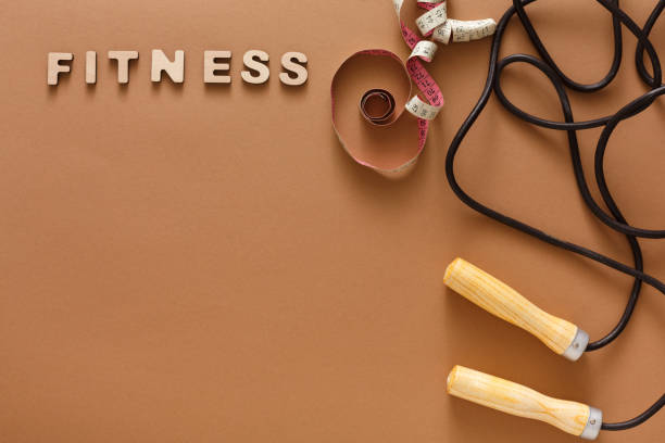 istock Fitness, jumping rope on black background 891978996