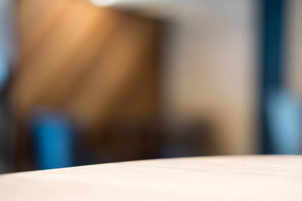istock Wooden table in cafe with blur bokeh abstract vintage background 891996600