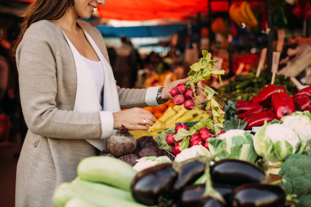 istock Young woman at the market. 891996788