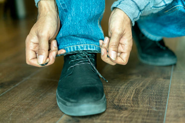 istock hand fastening shoelace 892005942