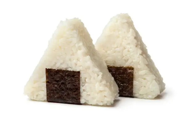 Fresh made Japanese triangular onigiri on white background