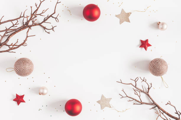 Christmas balls, beige and red decorations. Flat lay, top view