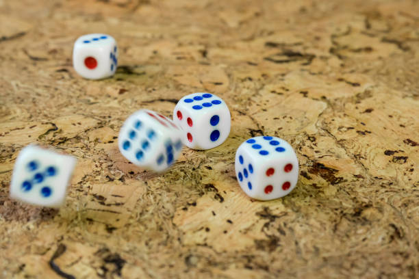 istock White bones thrown on the table with a brown cork finish. 892025266