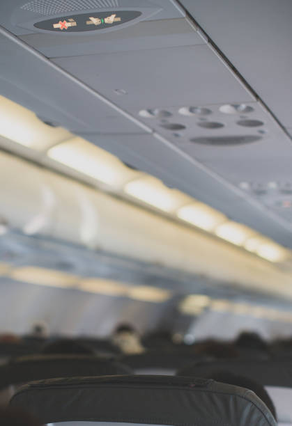 istock Interior inside of the plane with passengers. 892029126