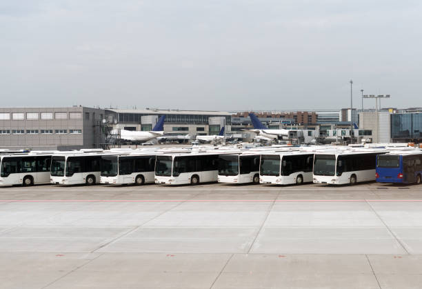 istock Airport shuttle buses standing on the airfield. 892029208