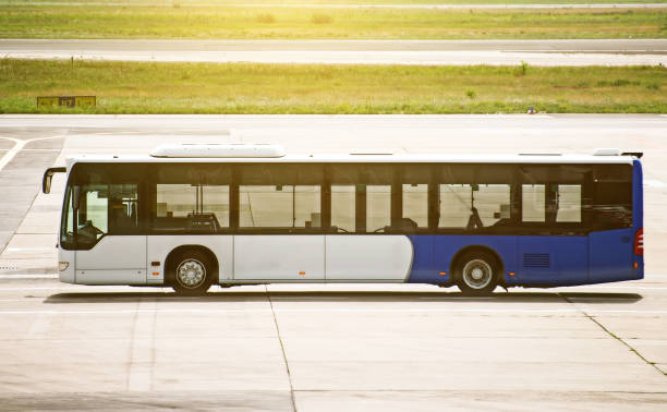 istock Airport shuttle bus standing on the airfield. 892029240