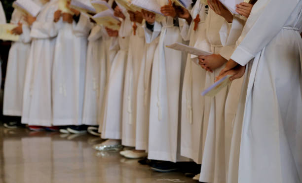 istock children with white tunic during the religious rite of the First 892029304